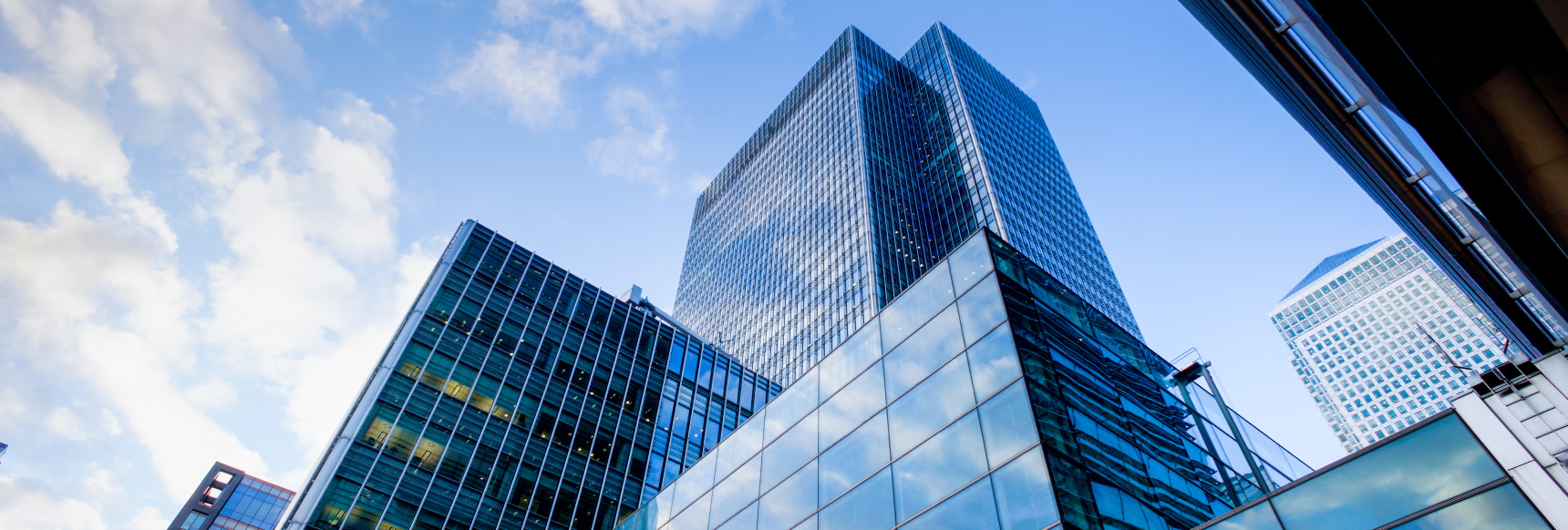 Modern glass skyscrapers against blue sky